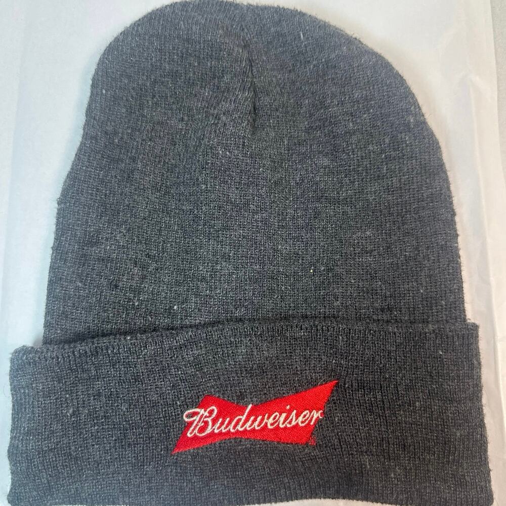 This gray Budweiser beanie features a red embroidered logo patch